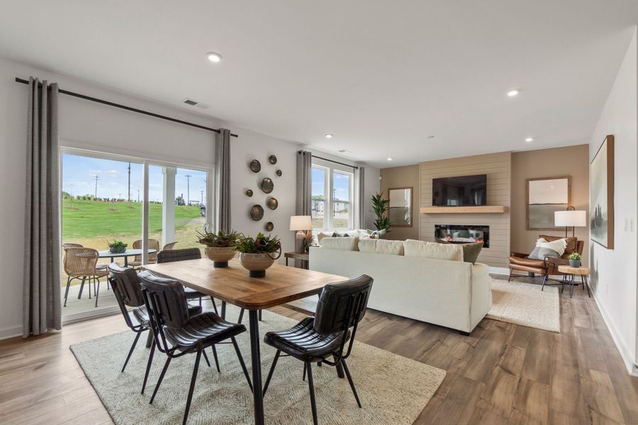 A living room with a large window. A living room with a large window.