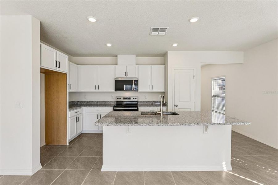 Furnished interior view inside a new home in , Lake Wales (Image 7).