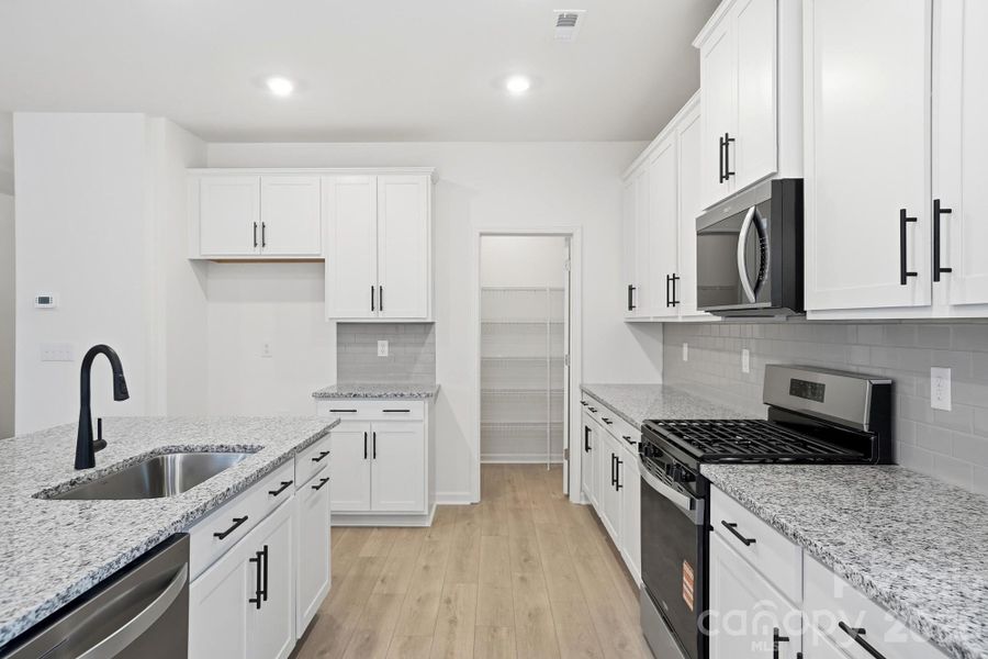 Furnished interior view inside a new home in Wellington Pointe Executive, Monroe (Image 20).