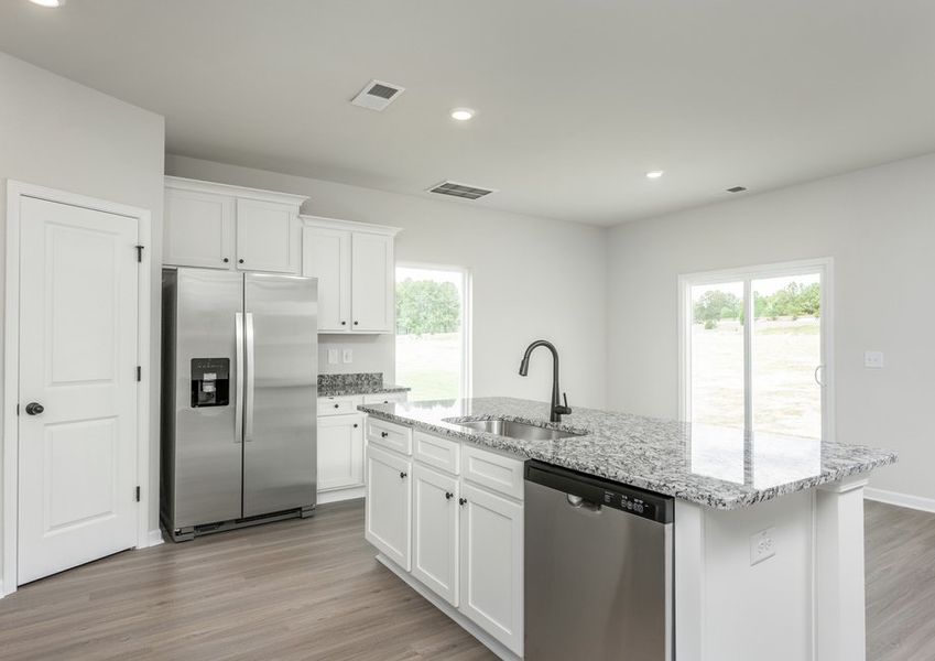 Kitchen overlooks the dining area