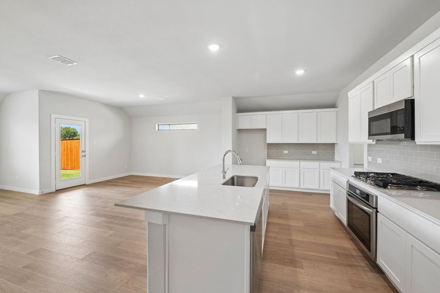 Kitchen in the Heisman home plan by Trophy Signature Homes Kitchen in the Heisman home plan by Trophy Signature Homes