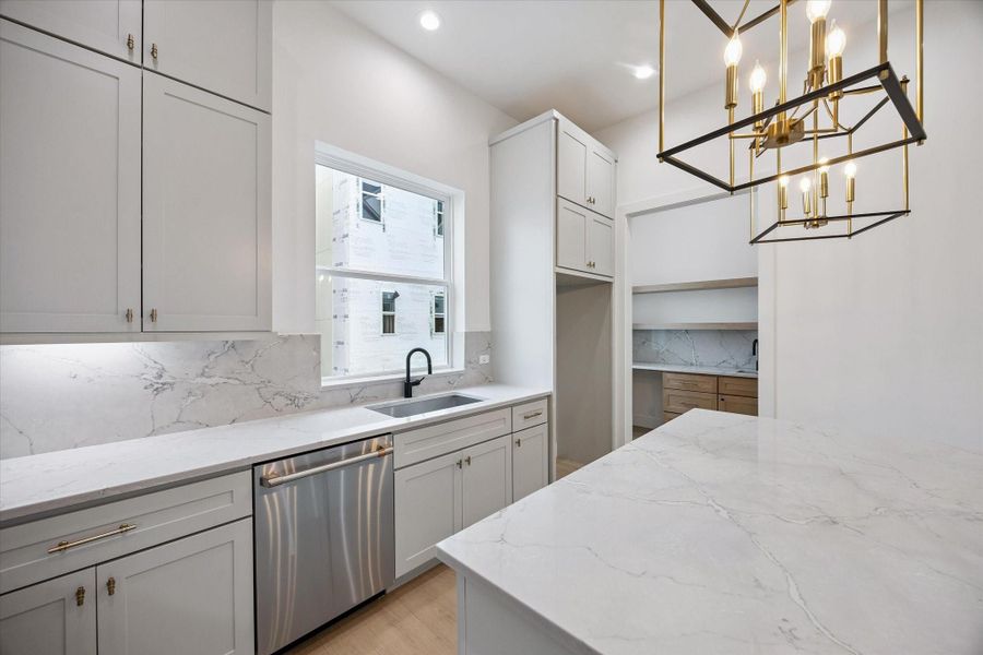 Gorgeous, chef-inspired kitchen with stylish details and an open layout that seamlessly connects to the main living areas.