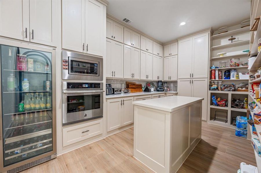 Furnished interior view inside a new home in , Pelican Bay (Image 6).