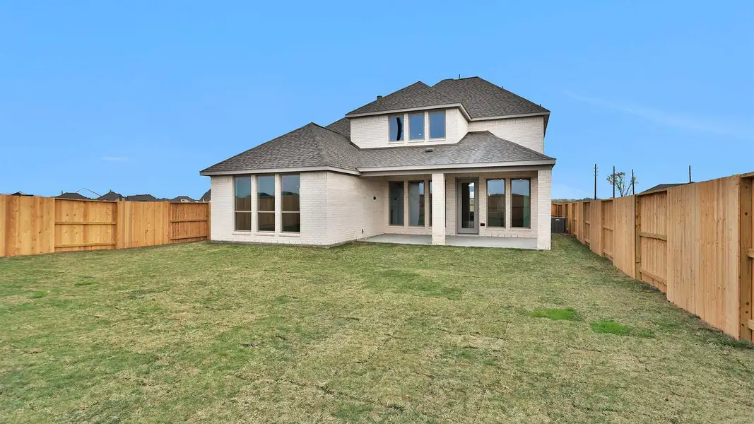 Exterior details and patio area of a home in Meridiana, Manvel (Image 3).