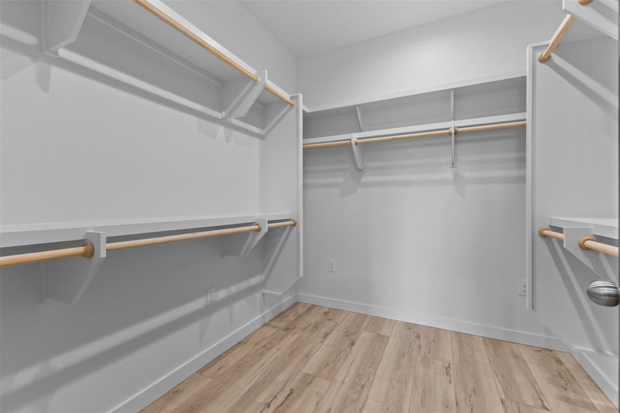 Walk in closet featuring light wood-style floors