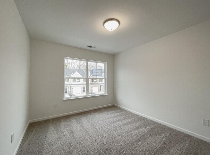 Spacious, unfurnished interior of a new home in East Main Townes, Spartanburg (Image 21).