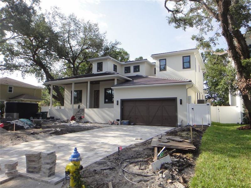 Front exterior of a new home in , Tampa, FL, highlighting curb appeal (Image 23). Front exterior of a new home in , Tampa, FL, highlighting curb appeal (Image 23).