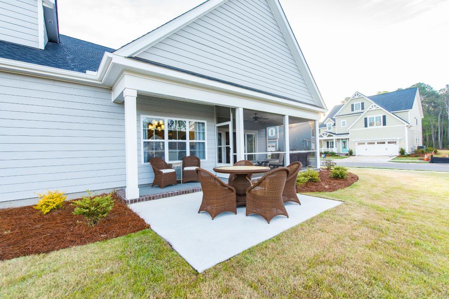 Representative exterior photo of a completed home built from the Helmsley by Bill Clark Homes in The Sanctuary at Sunset Beach, Sunset Beach, NC (Image 32). Representative exterior photo of a completed home built from the Helmsley by Bill Clark Homes in The Sanctuary at Sunset Beach, Sunset Beach, NC (Image 32).
