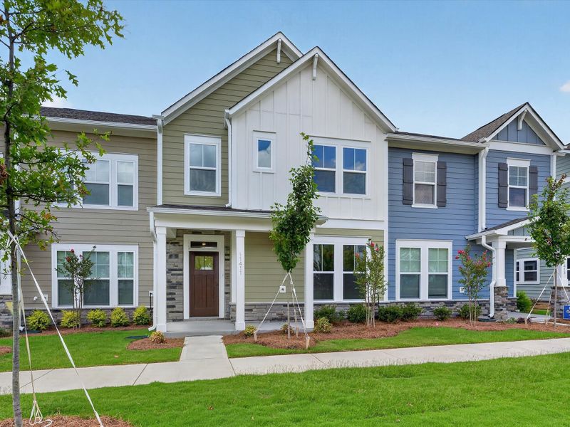 Front exterior of a new home in North Creek Village - Townhomes, Huntersville, NC, highlighting curb appeal (Image 22).