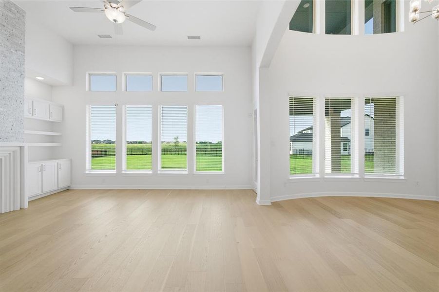 Vaulted ceilings complementing extensive windows with horizontal blinds