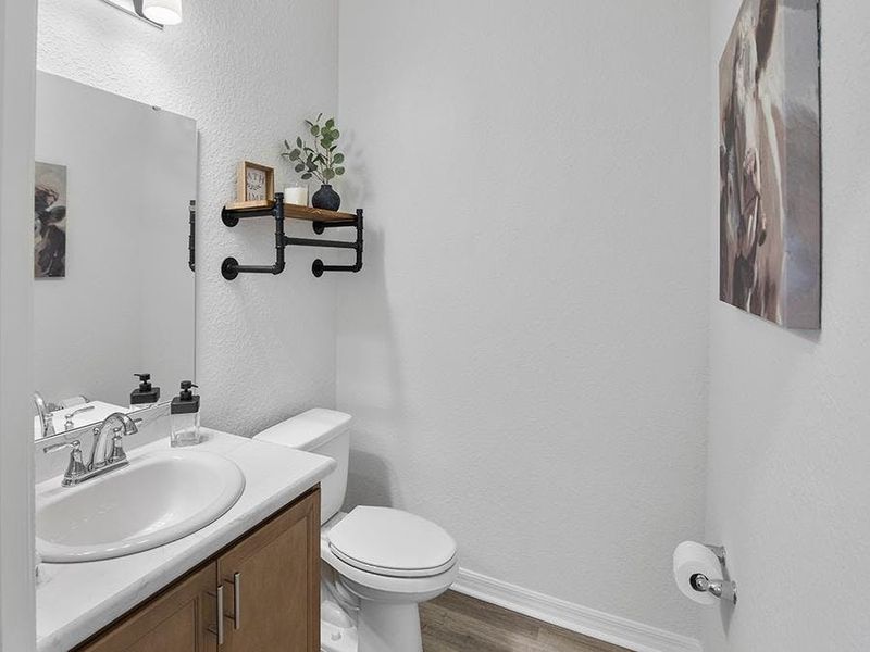 This home also includes a convenient powder room for guests - Summerlyn II by Highland Homes