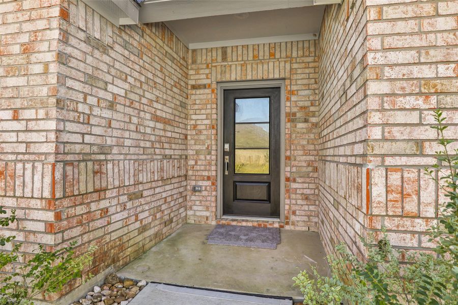 Spacious covered brick front entry for your family and guests. No one wants to stand in the rain or heat! Spacious covered brick front entry for your family and guests. No one wants to stand in the rain or heat!
