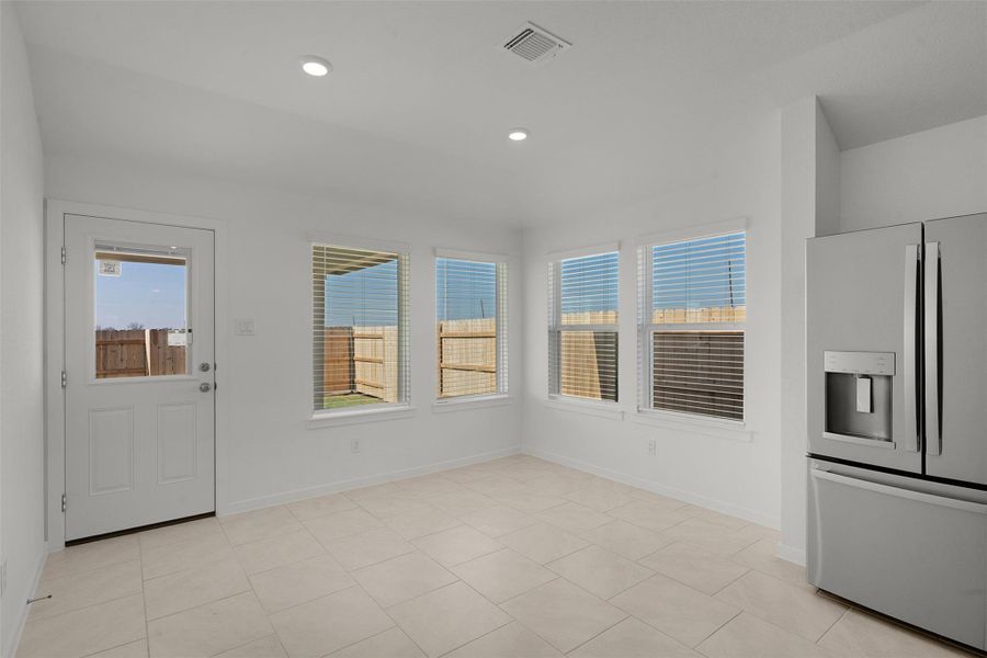 Unfurnished dining area featuring recessed lighting and light tile patterned floors
