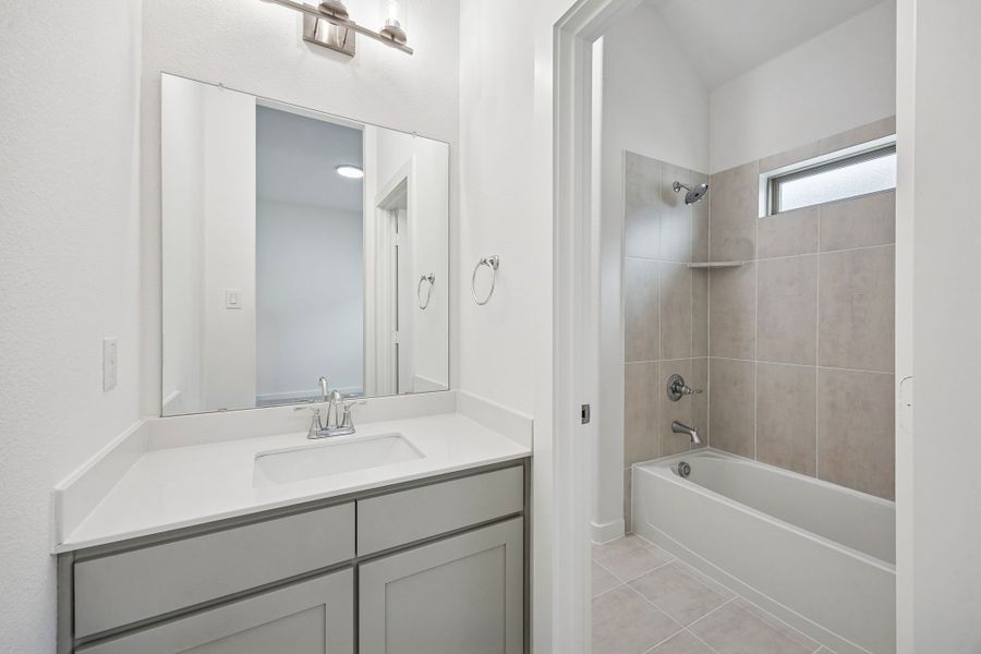 Bathroom in the Gilmour II home plan by Trophy Signature Homes – REPRESENTATIVE PHOTO