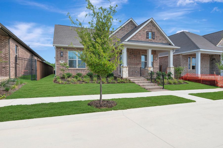 Front exterior of a new home in Elements at Viridian - Traditional Series, Arlington, TX, highlighting curb appeal (Image 25). Front exterior of a new home in Elements at Viridian - Traditional Series, Arlington, TX, highlighting curb appeal (Image 25).