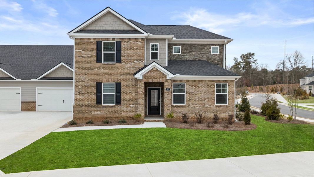 Front exterior of a new home in Independence Villas and Townhomes, Loganville, GA, highlighting curb appeal (Image 2).