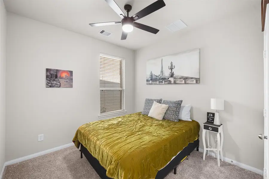 Cozy bedroom with neutral walls and carpet