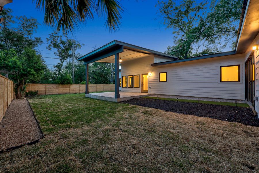 Backyard with a spacious covered patio and privacy fencing Backyard with a spacious covered patio and privacy fencing