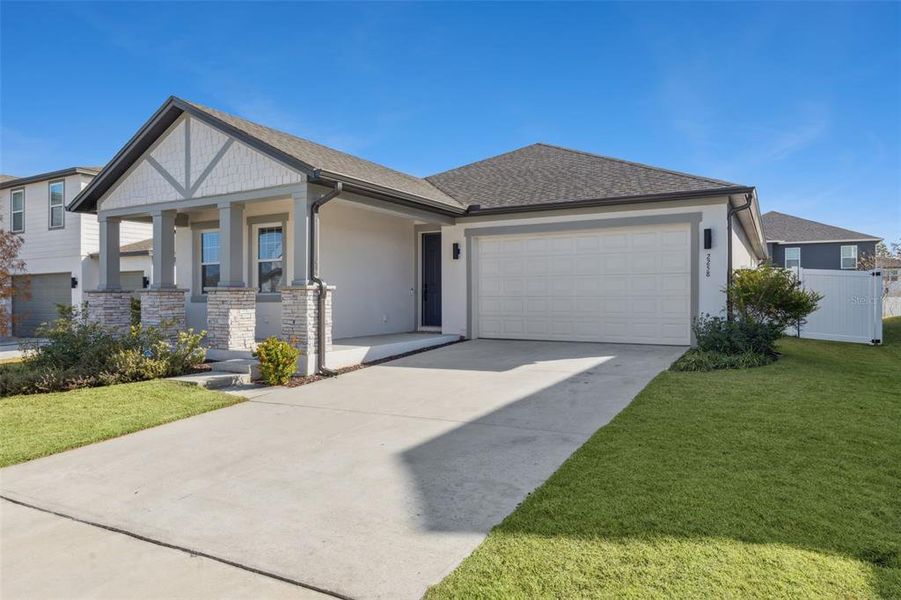Front exterior of a new home in , Minneola, FL, highlighting curb appeal (Image 28).