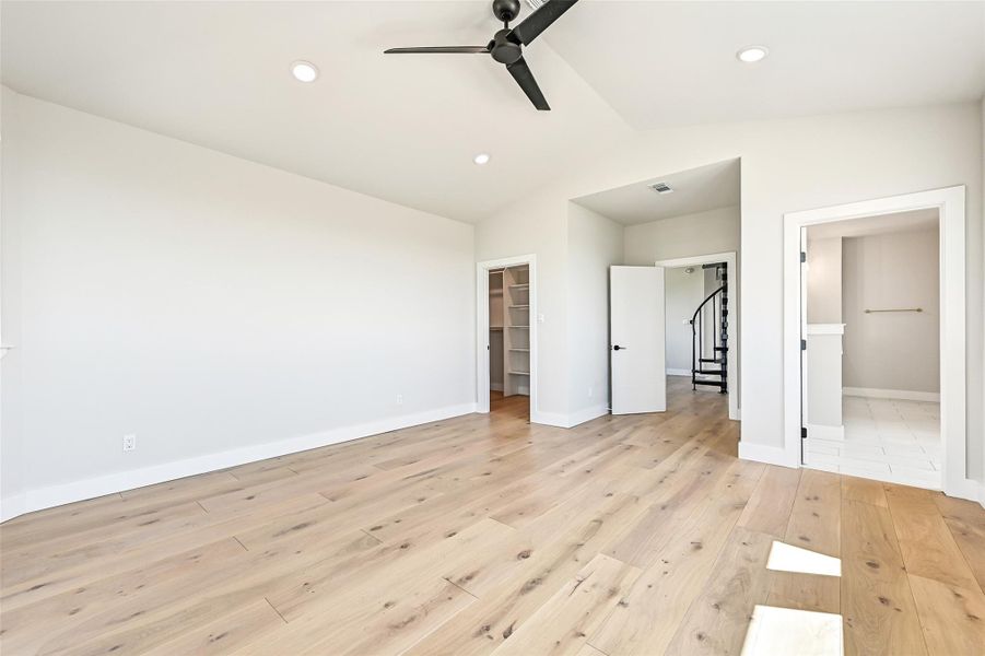 Wake up surrounded by soft coastal light in this luxurious primary suite complete with white oak floors, spa inspired bath access, and a spacious walk in closet. Every detail was designed for comfort and serenity.