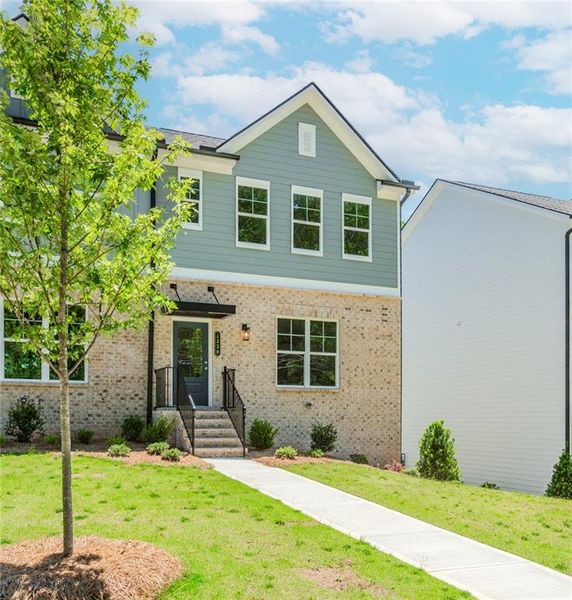 Front exterior of a new home in Hillcrest Landing, Sugar Hill, GA, highlighting curb appeal (Image 22). Front exterior of a new home in Hillcrest Landing, Sugar Hill, GA, highlighting curb appeal (Image 22).