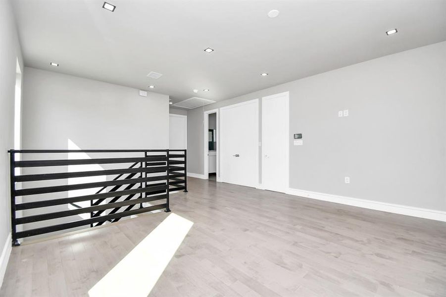 This is a compact, empty room with tiled flooring, neutral wall paint, and the necessary hookups for a washer and dryer. It appears to be a dedicated laundry or utility space.