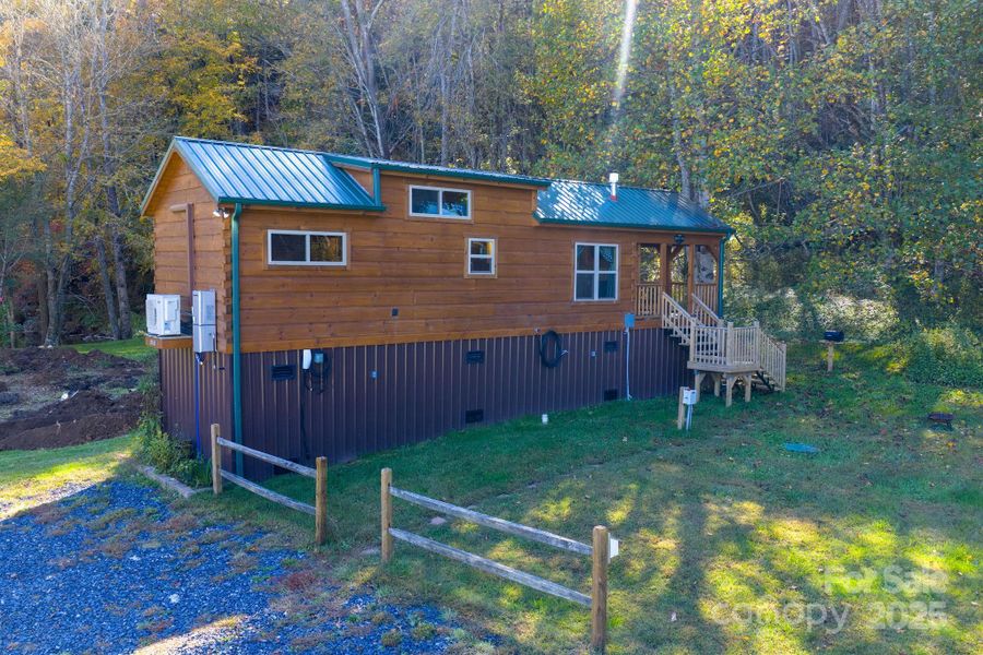 Gravel parking out front of cabin