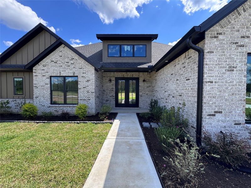 Exterior details and patio area of a home in , Conroe (Image 1). Exterior details and patio area of a home in , Conroe (Image 1).