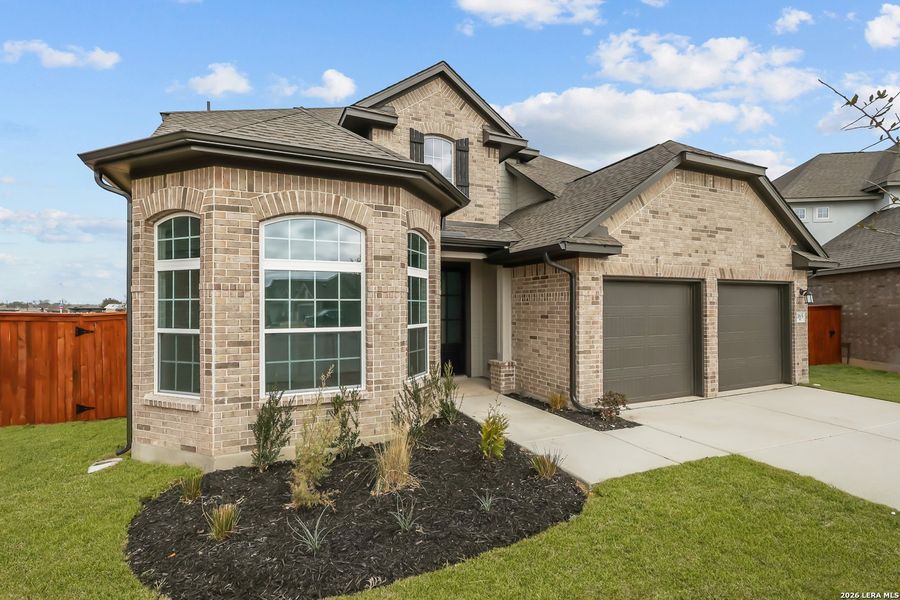 Front exterior of a new home in Megan's Landing, Castroville, TX, highlighting curb appeal (Image 2). Front exterior of a new home in Megan's Landing, Castroville, TX, highlighting curb appeal (Image 2).