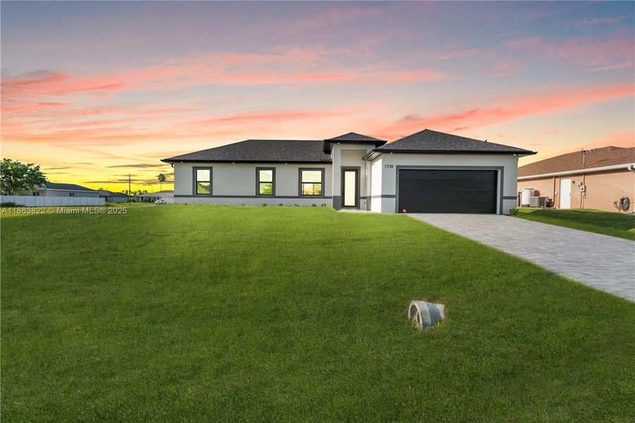 Front exterior of a new home in , Cape Coral, FL, highlighting curb appeal (Image 17). Front exterior of a new home in , Cape Coral, FL, highlighting curb appeal (Image 17).