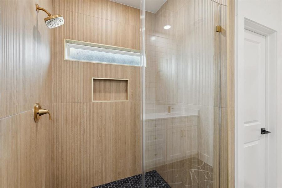 Bathroom featuring a shower stall