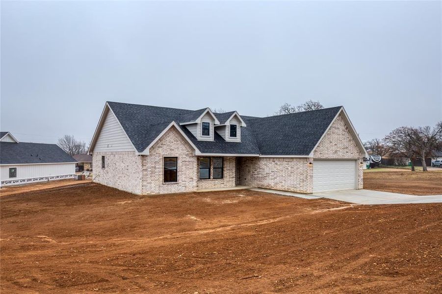 Front exterior of a new home in , Jacksboro, TX, highlighting curb appeal (Image 21). Front exterior of a new home in , Jacksboro, TX, highlighting curb appeal (Image 21).