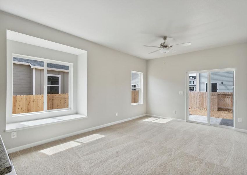 The open layout of this home has the family room open to the kitchen.