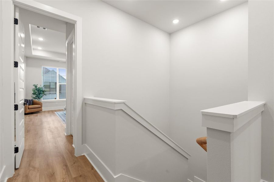 A functional landing area that creates a smooth transition between bedrooms and living spaces upstairs, complemented by 10' ceilings that add a sense of openness rarely found on the second floor. A functional landing area that creates a smooth transition between bedrooms and living spaces upstairs, complemented by 10' ceilings that add a sense of openness rarely found on the second floor.