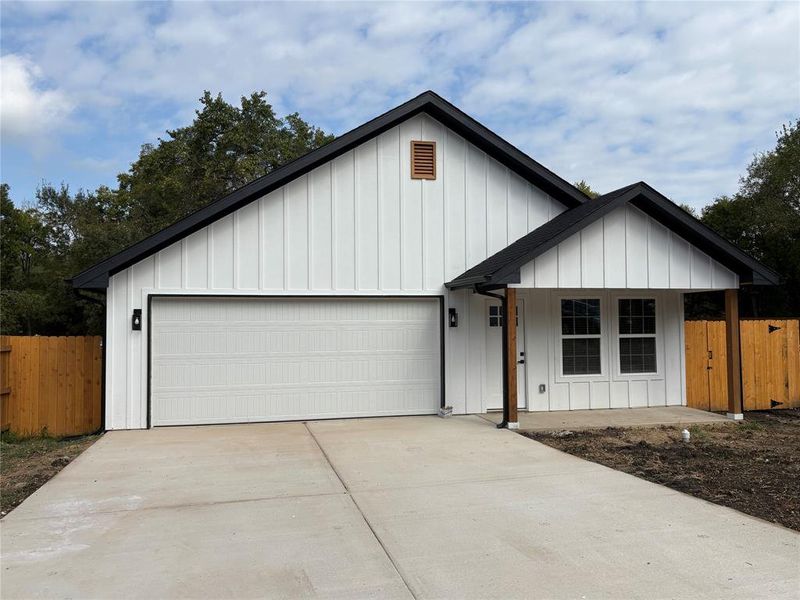 Front exterior of a new home in , Cooper, TX, highlighting curb appeal (Image 2).