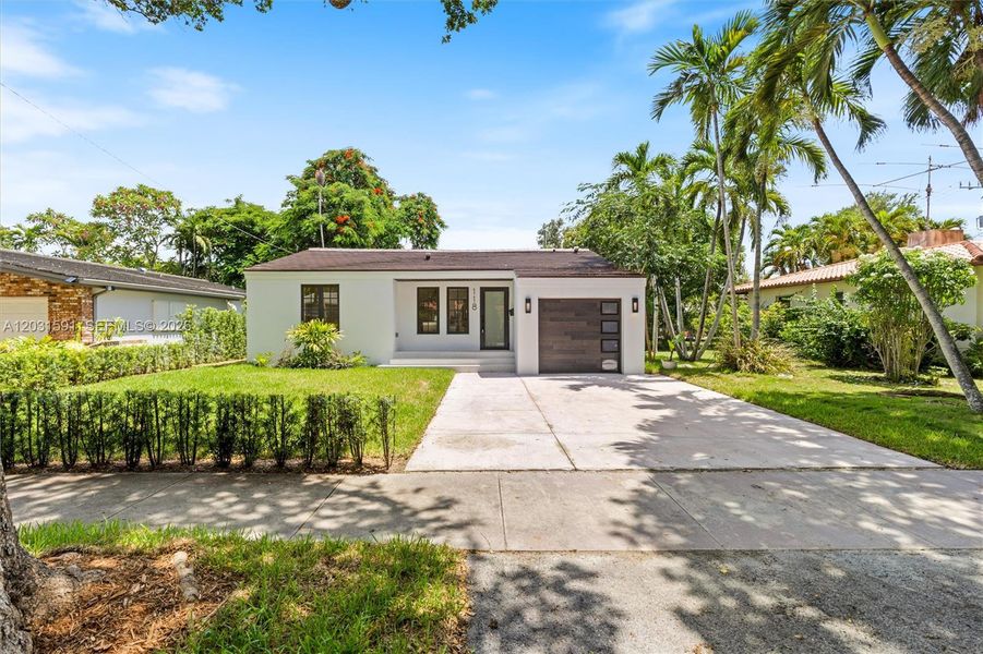 Front exterior of a new home in , Coral Gables, FL, highlighting curb appeal (Image 2). Front exterior of a new home in , Coral Gables, FL, highlighting curb appeal (Image 2).