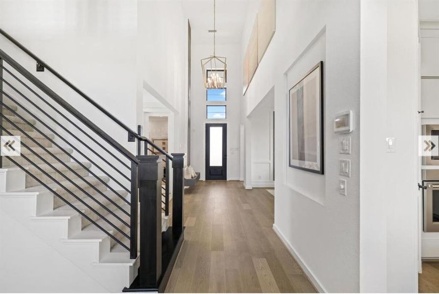 Modern staircase leads you to 3 bedrooms, 2 full baths and a game room.