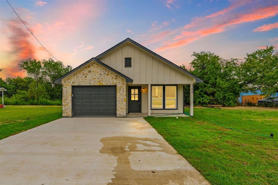 Front exterior of a new home in , Greenville, TX, highlighting curb appeal (Image 2). Front exterior of a new home in , Greenville, TX, highlighting curb appeal (Image 2).