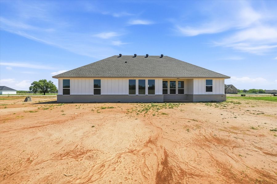 Front exterior of a new home in Zion Valley, Poolville, TX, highlighting curb appeal (Image 20).