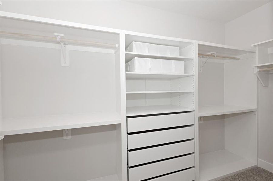 A thoughtfully designed Walk-In Custom Closet System with Soft Close Drawers, Shelving, and a Wall of Shelving (not pictured). A thoughtfully designed Walk-In Custom Closet System with Soft Close Drawers, Shelving, and a Wall of Shelving (not pictured).
