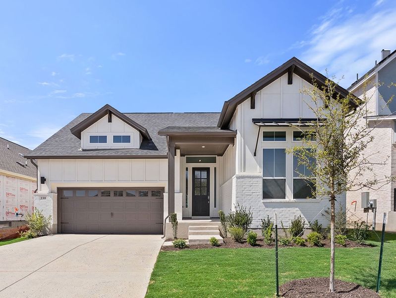 Front exterior of a new home in Persimmon, Buda, TX, highlighting curb appeal (Image 1). Front exterior of a new home in Persimmon, Buda, TX, highlighting curb appeal (Image 1).
