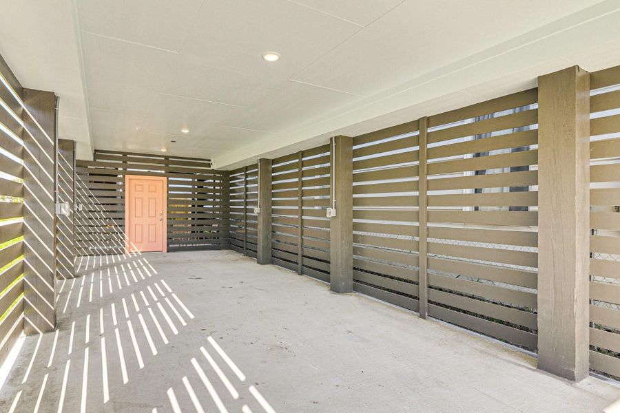 Long open garage under home with security door Long open garage under home with security door