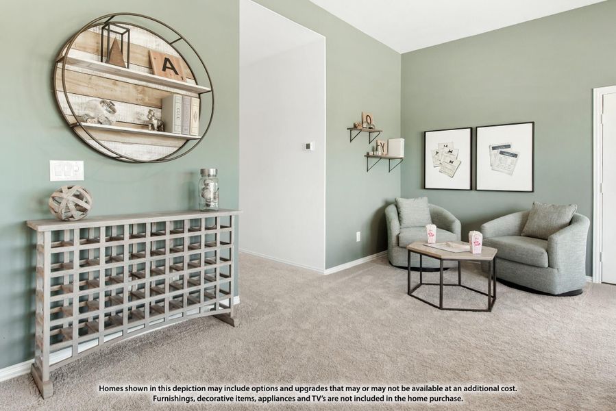 Sitting room with sage green walls, carpet flooring, two gray chairs, and a decorative metal console table with round mirror. Sitting room with sage green walls, carpet flooring, two gray chairs, and a decorative metal console table with round mirror.