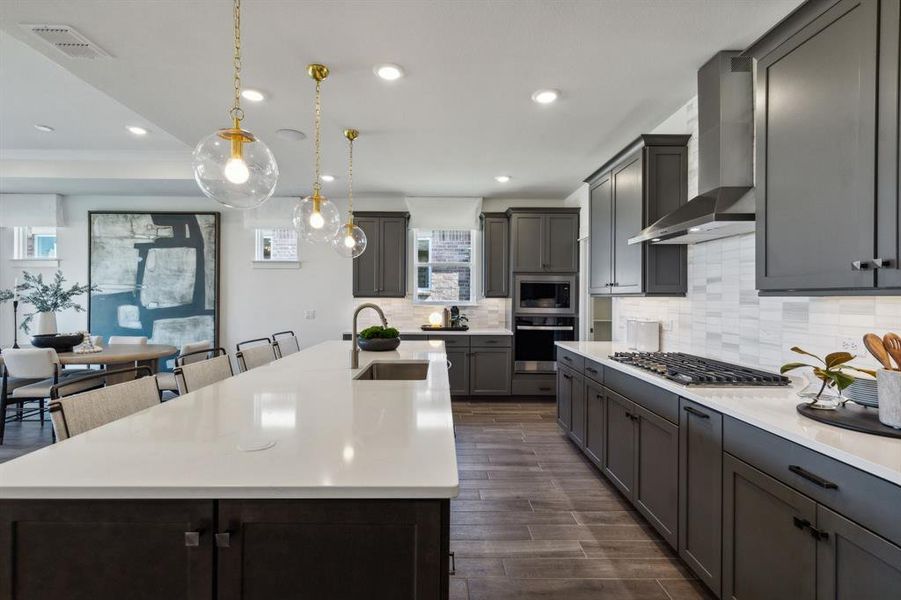 Model Representation* - Large island overlooking gathering room and dining areas