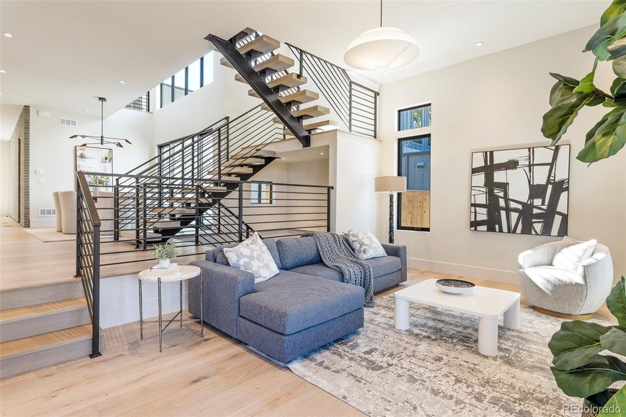 Sunken den/tv room with a double sided fireplace
