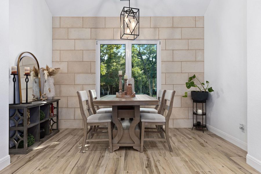 Dining space with wood finished floors Dining space with wood finished floors