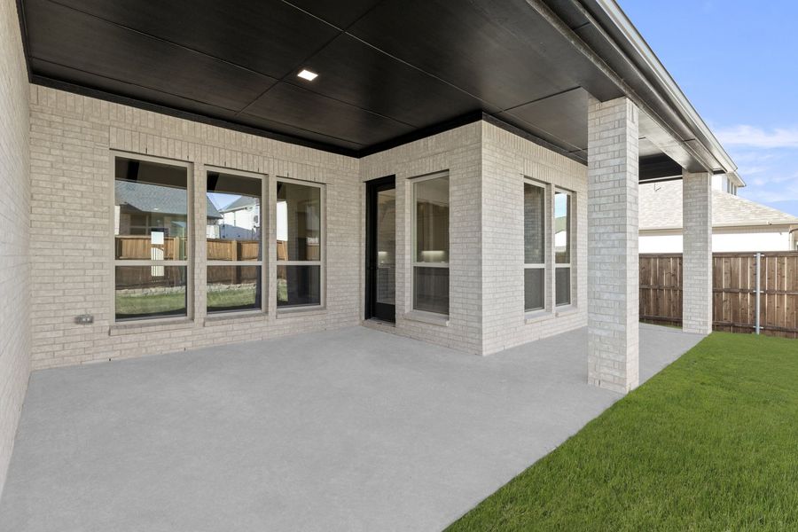 Exterior details and patio area of a home in Estates at Rockhill, Frisco (Image 3). Exterior details and patio area of a home in Estates at Rockhill, Frisco (Image 3).