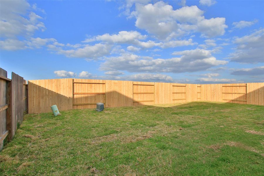 Exterior details and patio area of a home in Sunterra, Katy (Image 18).