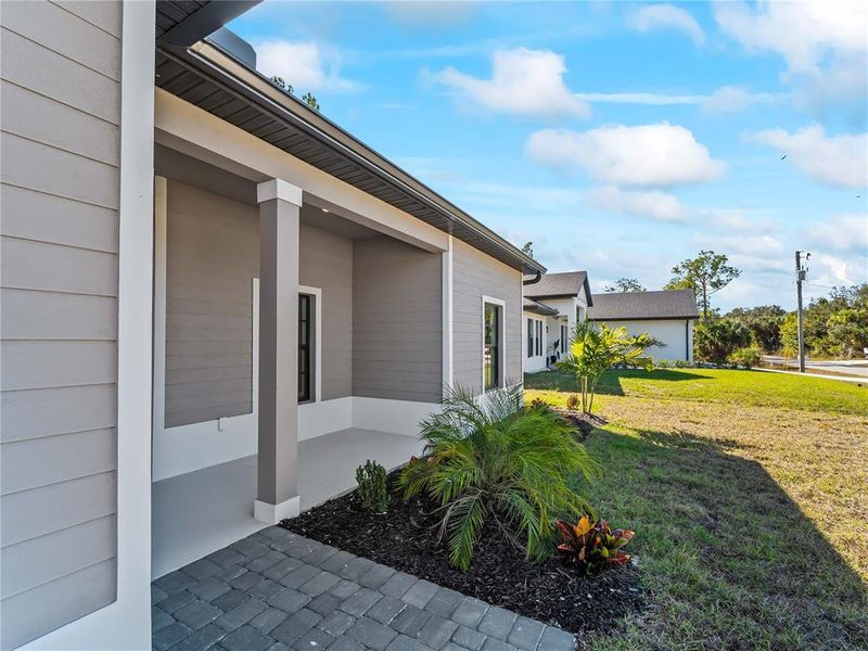 Exterior details and patio area of a home in , North Port (Image 31).