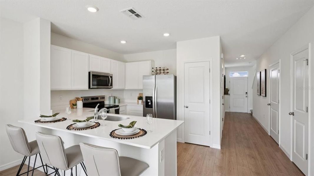 Furnished interior view inside a new home in Towns at Woodsdale, Wesley Chapel (Image 9).